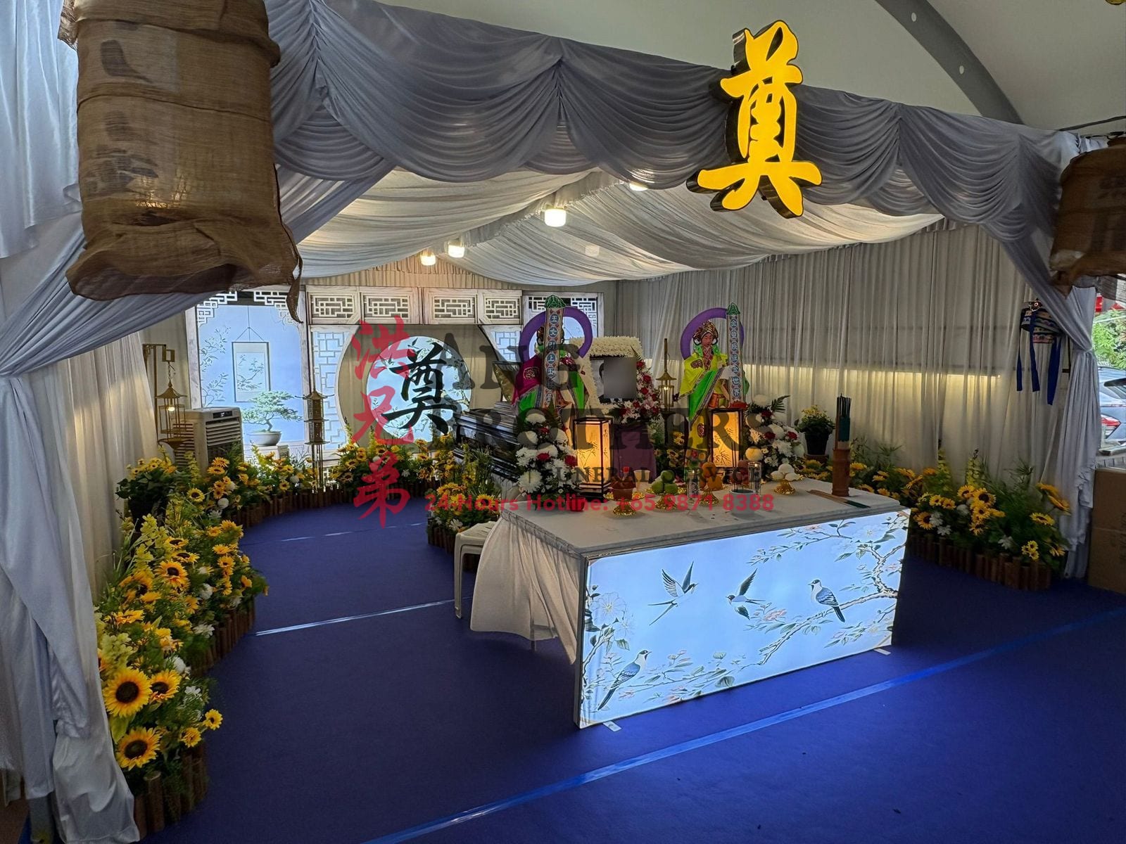 Taoist altar dressed with sunflowers and deity figures